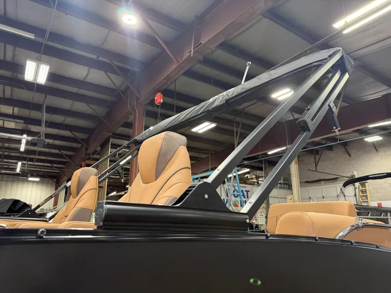 Slide: The Image of 2025 Tahoe Cascade 2385 Tritoon with luxury seating in a warehouse. - 45