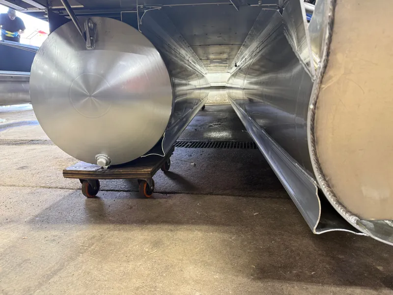 Slide: The Image of Underside of a 2025 Tahoe Cascade 2385 Tritoon boat. - 49