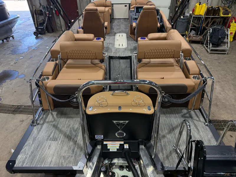 Slide: The Image of Interior view of 2025 Tahoe Cascade 2385 Tritoon with leather seating. - 6