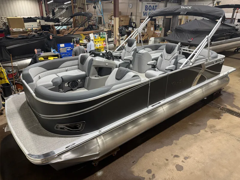 The Image of 2026 Tahoe LTZ 2385 Quad Lounge pontoon boat in a workshop. - 1