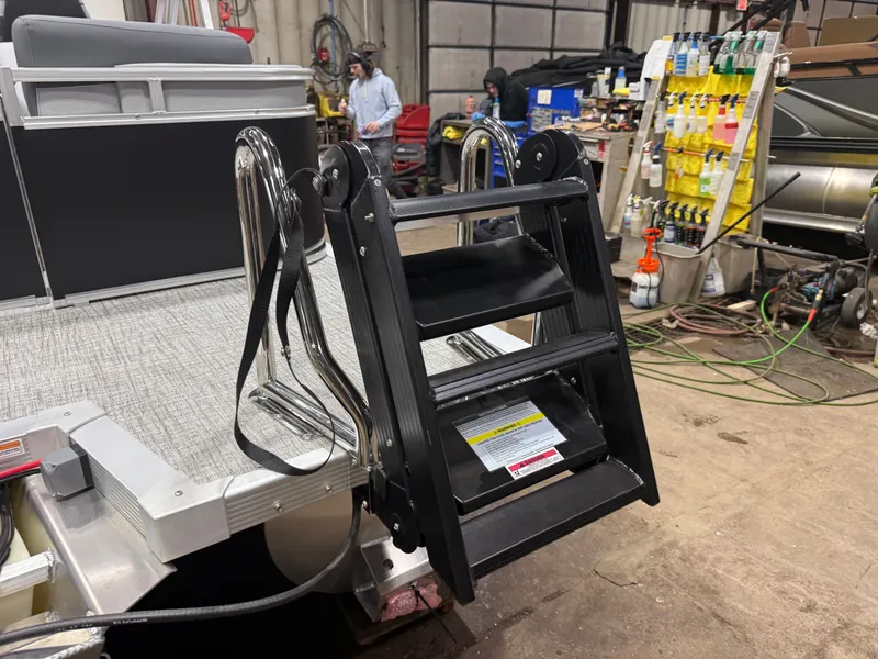 Slide: The Image of 2026 Tahoe LTZ 2385 Quad Lounge boat ladder in workshop. - 44