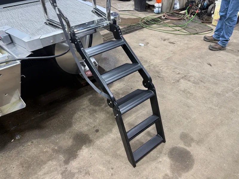 Slide: The Image of Tahoe LTZ 2385 boat ladder in workshop setting, 2026 model. - 45
