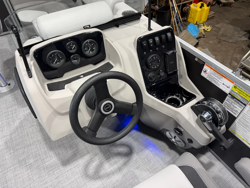 Slide: The Image of 2026 Princecraft Vectra 21 Pontoon helm with modern controls and gauges. - 12