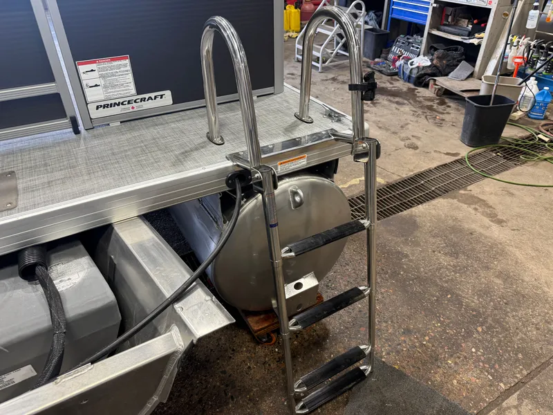 Slide: The Image of Princecraft Vectra 21 Pontoon with ladder in workshop. - 33