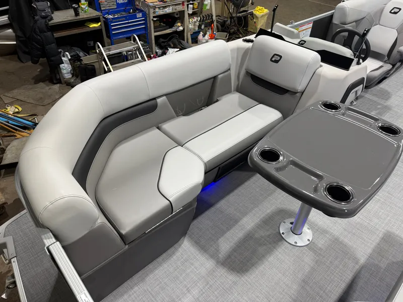 Slide: The Image of Interior of Princecraft Vectra 21 Pontoon with gray table and seating area. - 7