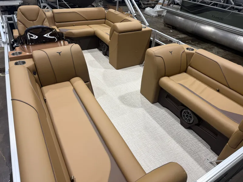 Slide: The Image of Interior of 2026 Tahoe Sport 1980 Cruise with beige leather seating. - 27