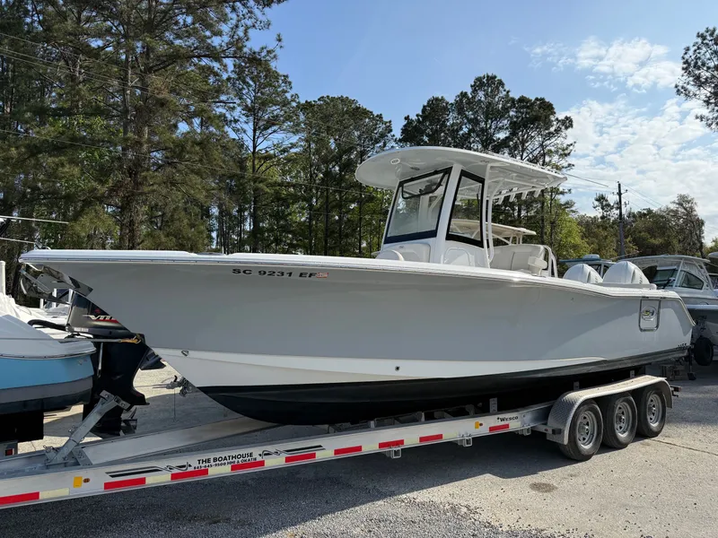 The Image of 2025 Sea Hunt Ultra 275 SE boat on trailer outdoors. - 1