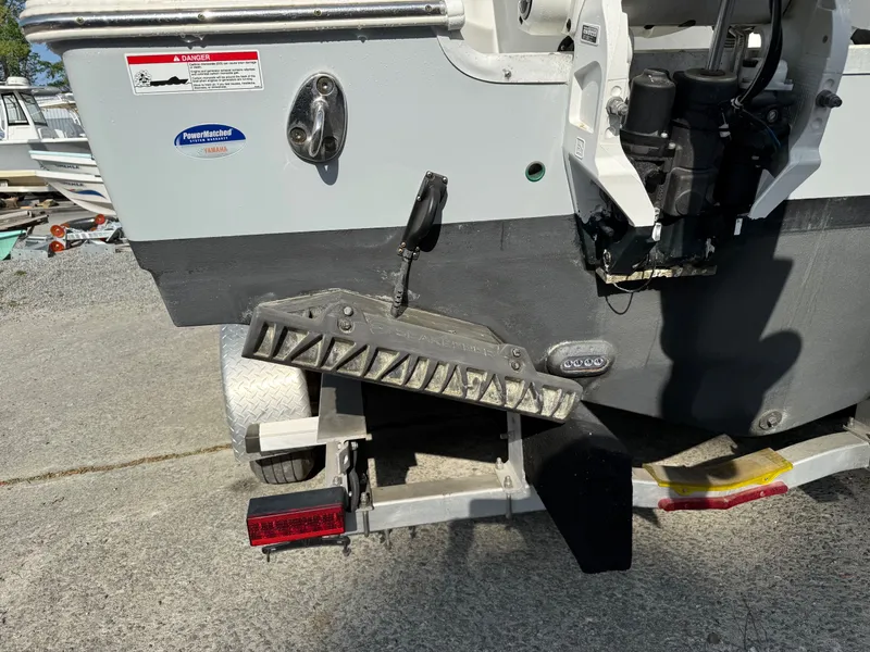 Slide: The Image of Rear view of a 2025 Sea Hunt Ultra 275 SE boat. - 3