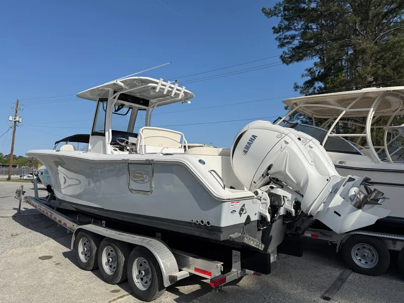 Slide: The Image of 2025 Sea Hunt Ultra 275 SE boat on trailer, side view. - 5