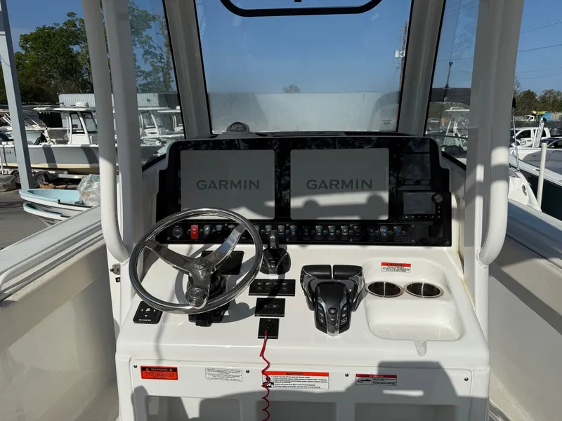 Slide: The Image of Sea Hunt Ultra 275 SE 2025 helm with Garmin displays. - 8