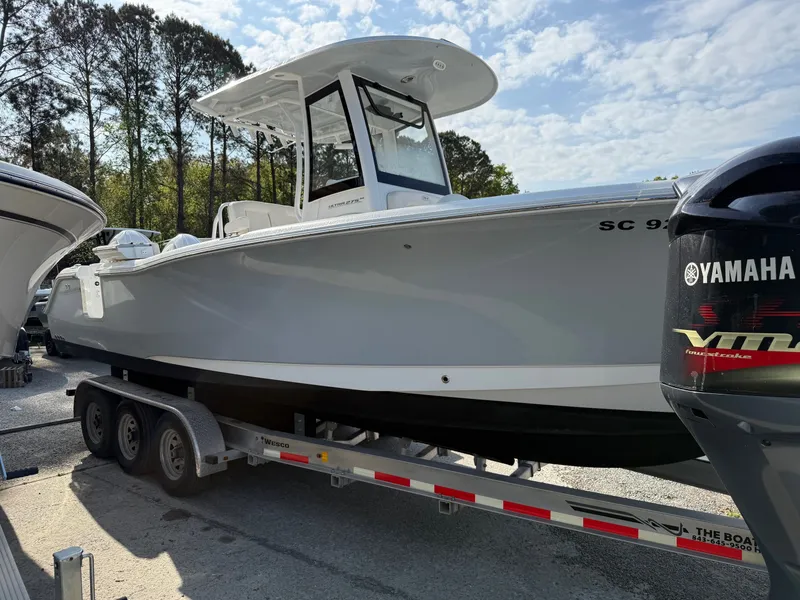 Slide: The Image of 2025 Sea Hunt Ultra 275 SE boat on trailer, side view. - 9