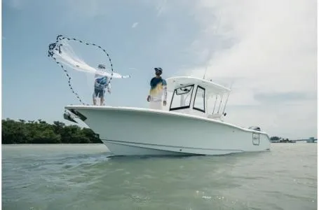 Slide: The Image of 2022 Sea Hunt Gamefish 25 boat fishing on the water. - 11