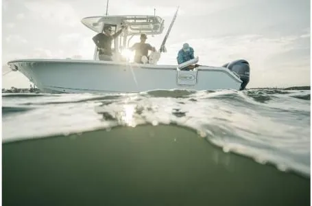 Slide: The Image of 2022 Sea Hunt Gamefish 25 boat on water with anglers. - 5