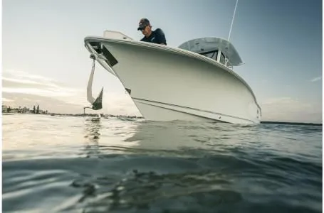 Slide: The Image of 2022 Sea Hunt Gamefish 25 boat on calm water. - 8