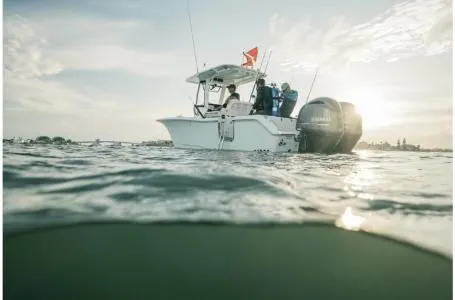 Slide: The Image of 2022 Sea Hunt Gamefish 25 on the water at sunset. - 9