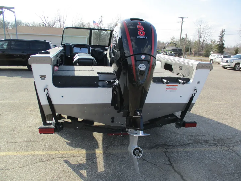 Slide: The Image of Rear view of a 2026 Lund 1875 Tyee boat with outboard motor. - 6