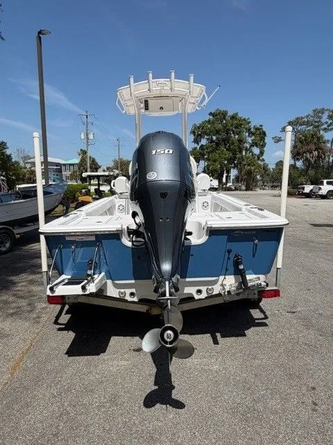 Slide: The Image of Rear view of a 2022 Sportsman Masters 207 boat with outboard motor. - 13