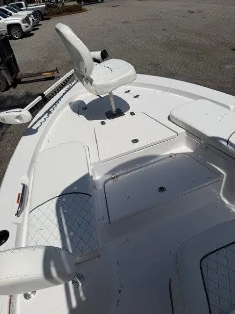 Slide: The Image of Interior view of a 2022 Sportsman Masters 207 boat, white upholstery. - 15