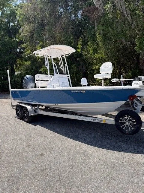 Slide: The Image of 2022 Sportsman Masters 207 boat parked on trailer outdoors. - 16
