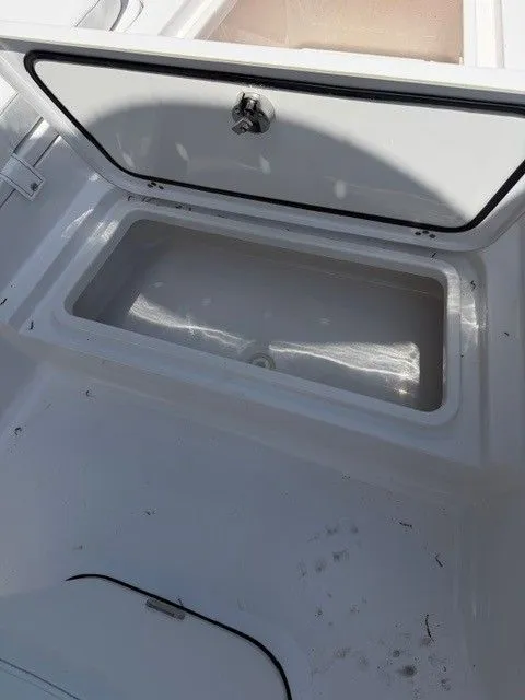 Slide: The Image of Open storage compartment in Sportsman Masters 207 boat, 2022 model. - 21