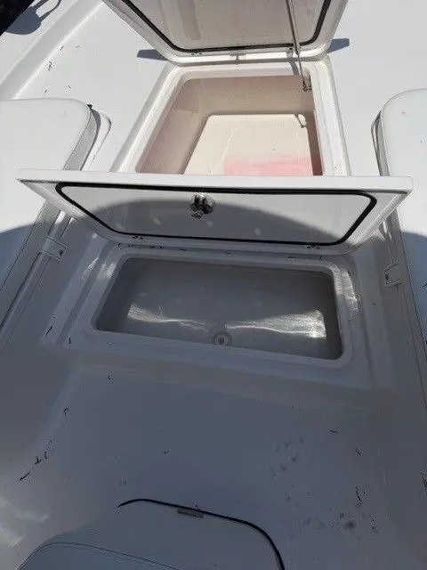 Slide: The Image of Open storage compartments on a 2022 Sportsman Masters 207 boat. - 22