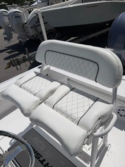 Slide: The Image of White cushioned bench on Sportsman Masters 207 boat, 2022 model. - 3