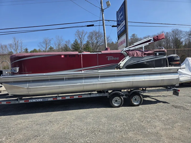 The Image of 2017 Tahoe LTZ Cruise 24 pontoon boat on trailer. - 1