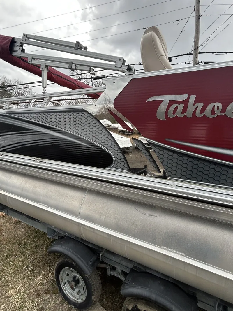 Slide: The Image of Damaged 2017 Tahoe LTZ Cruise 24 pontoon boat on trailer. - 3