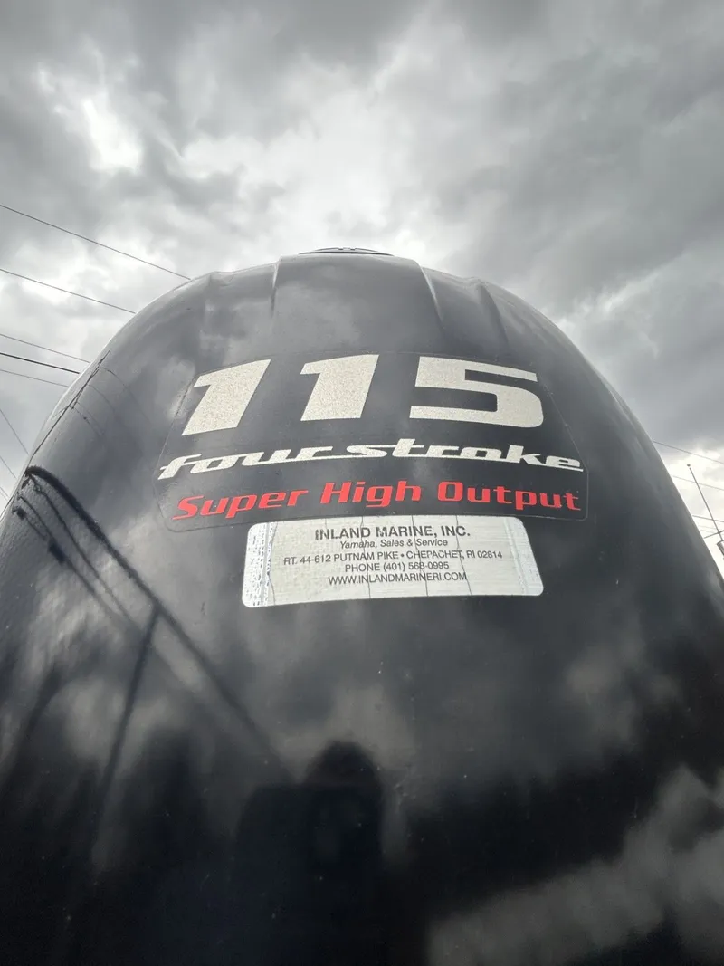 Slide: The Image of 115 horsepower four-stroke engine with Super High Output sticker. - 5