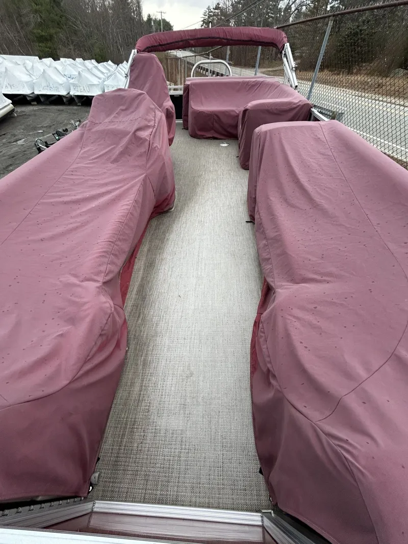 Slide: The Image of 2017 Tahoe LTZ Cruise 24 with maroon covers on deck. - 6