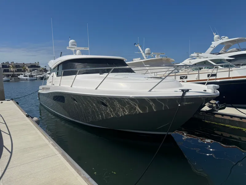 The Image of 2018 Tiara Yachts C44 docked, sleek design. - 0