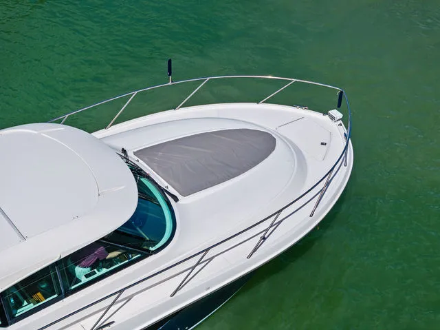 Slide: The Image of 2018 Tiara Yachts C44 helm with Garmin displays and controls. - 15