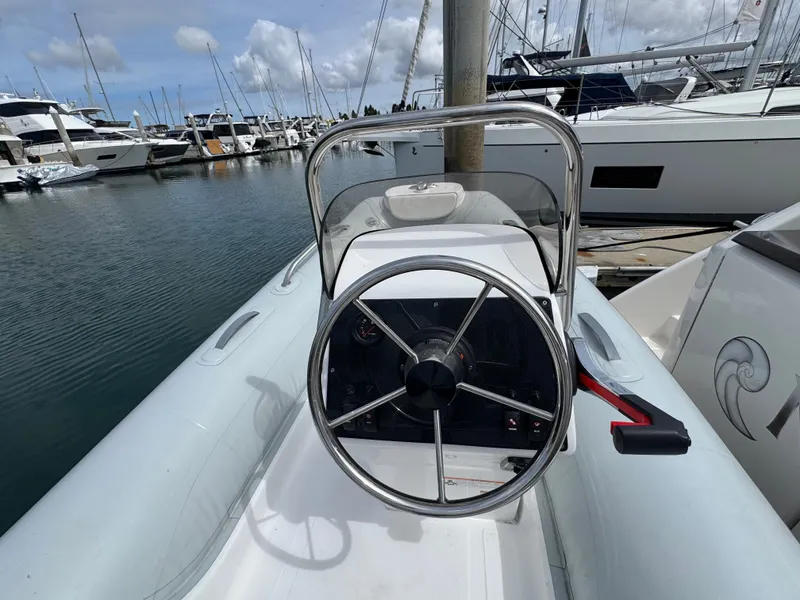 Slide: The Image of Helm of a 2018 Tiara Yachts C44 at the marina. - 26