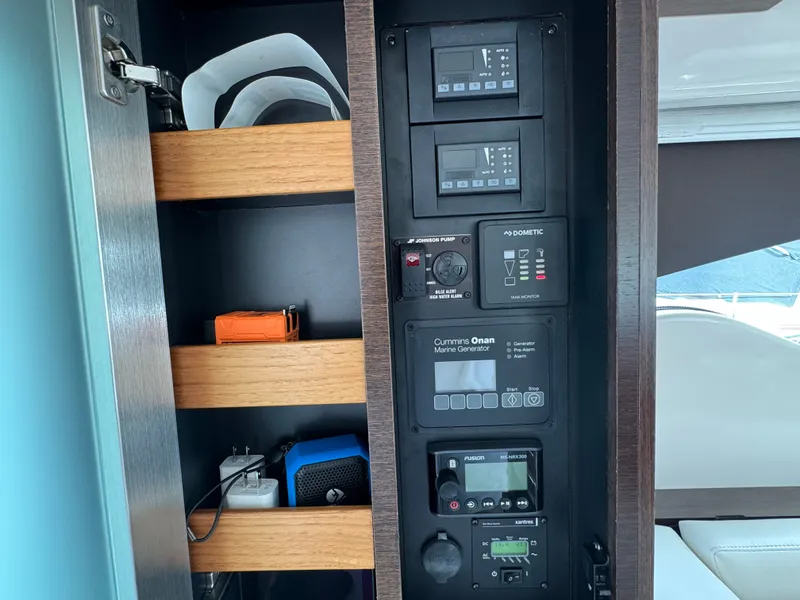 Slide: The Image of Control panel of 2018 Tiara Yachts C44 with shelving. - 34