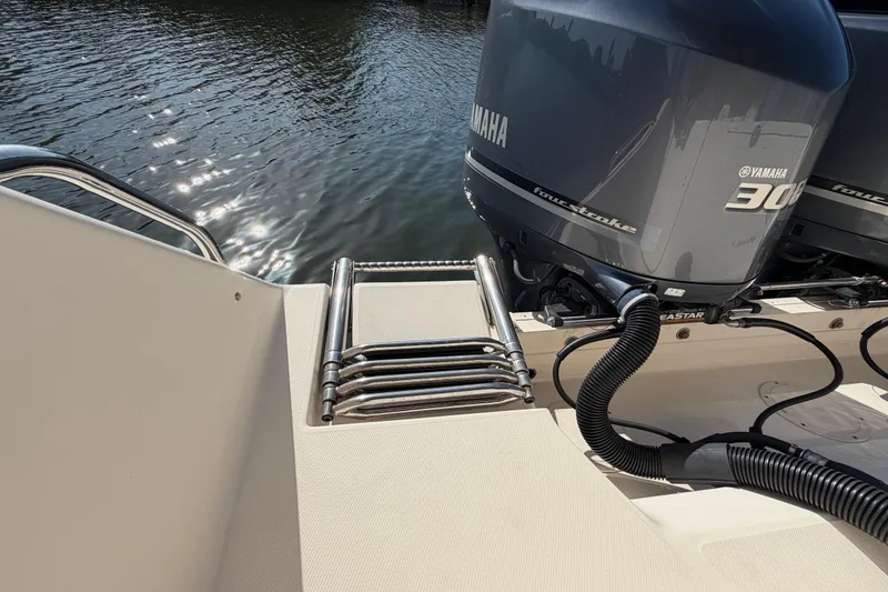 Slide: The Image of 2018 Grady-White Canyon 306 boat with Yamaha outboard engines and swim ladder. - 19