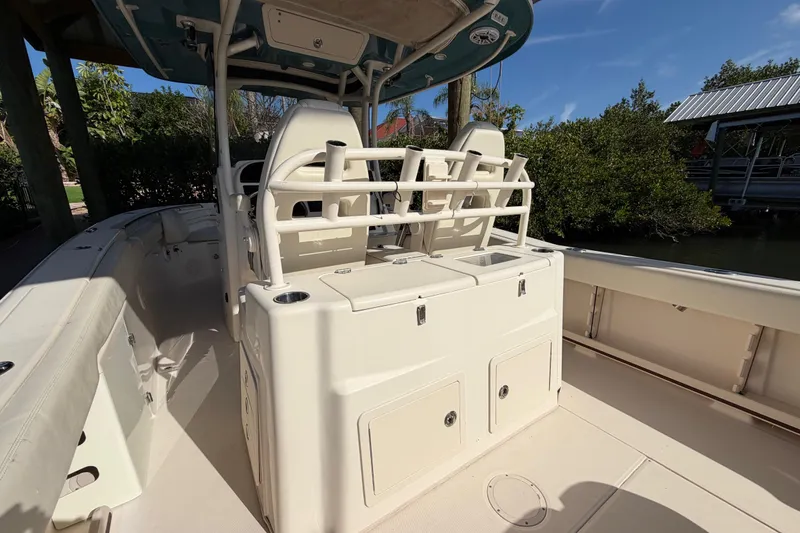 Slide: The Image of 2018 Grady-White Canyon 306 boat interior with seating and storage compartments. - 22