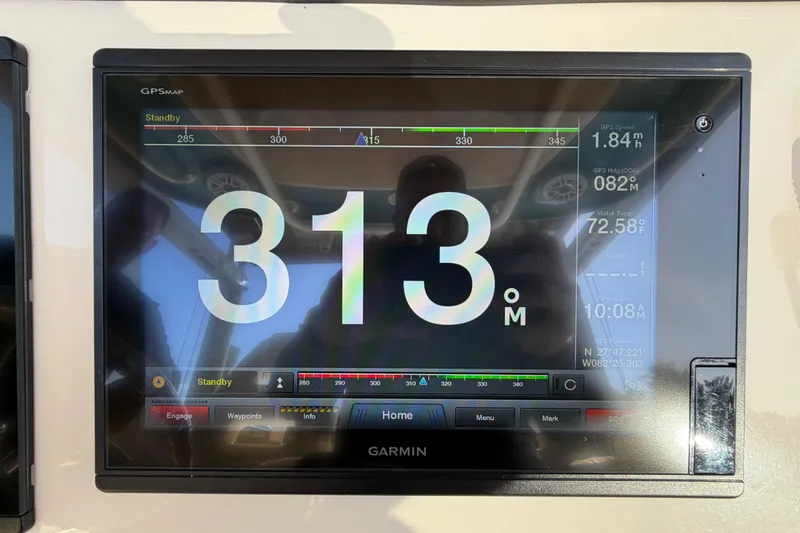 Slide: The Image of Garmin GPS display on 2018 Grady-White Canyon 306 boat, showing speed and navigation data. - 27