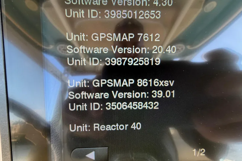 Slide: The Image of Display screen showing GPSMAP software versions and unit IDs on a Grady-White Canyon 306 boat. - 28