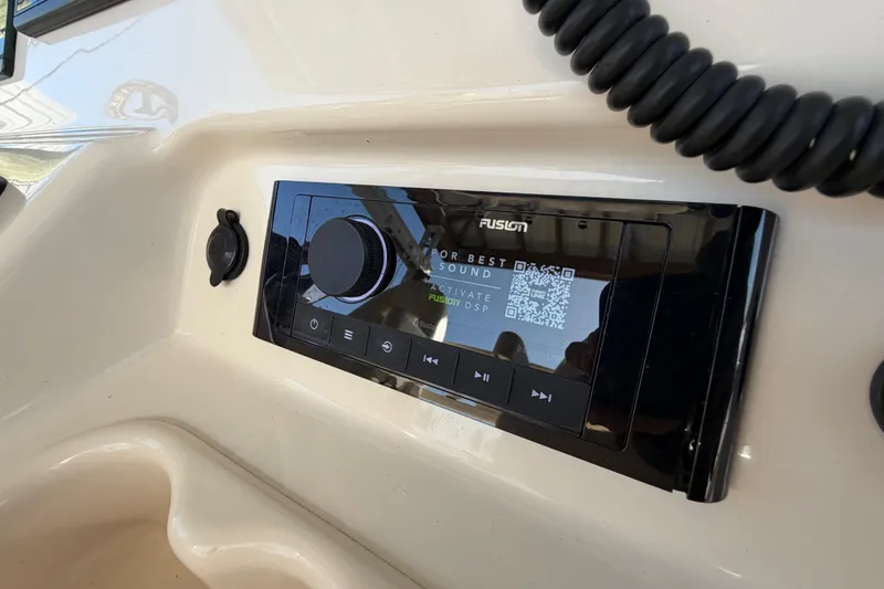 Slide: The Image of Fusion audio system on 2018 Grady-White Canyon 306 boat dashboard. - 30