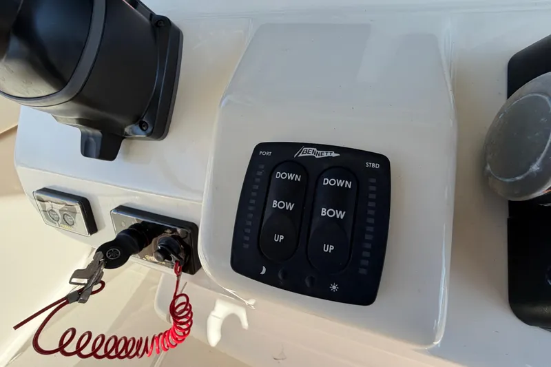 Slide: The Image of Control panel of a 2018 Grady-White Canyon 306 boat with Bennett trim tab switches. - 31