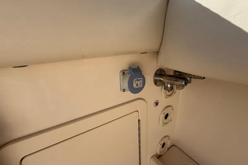Slide: The Image of 2018 Grady-White Canyon 306 boat interior detail with utility connections. - 39