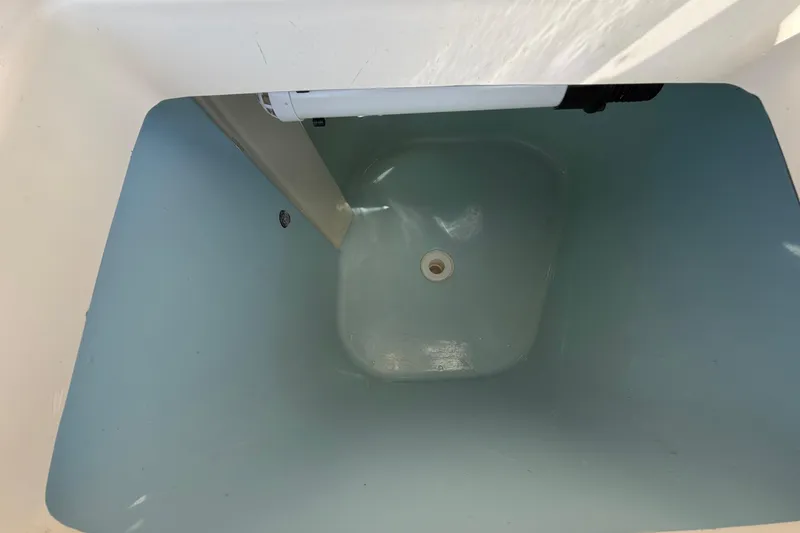 Slide: The Image of Livewell interior of 2018 Grady-White Canyon 306 boat, showing clean, empty compartment. - 40