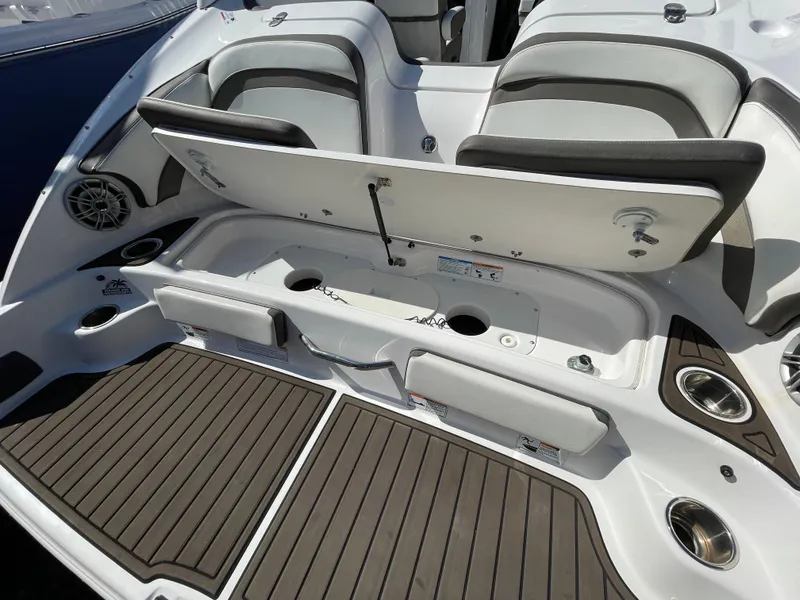 Slide: The Image of 2015 Yamaha Boats 242 Limited S, rear seating area with storage. - 13