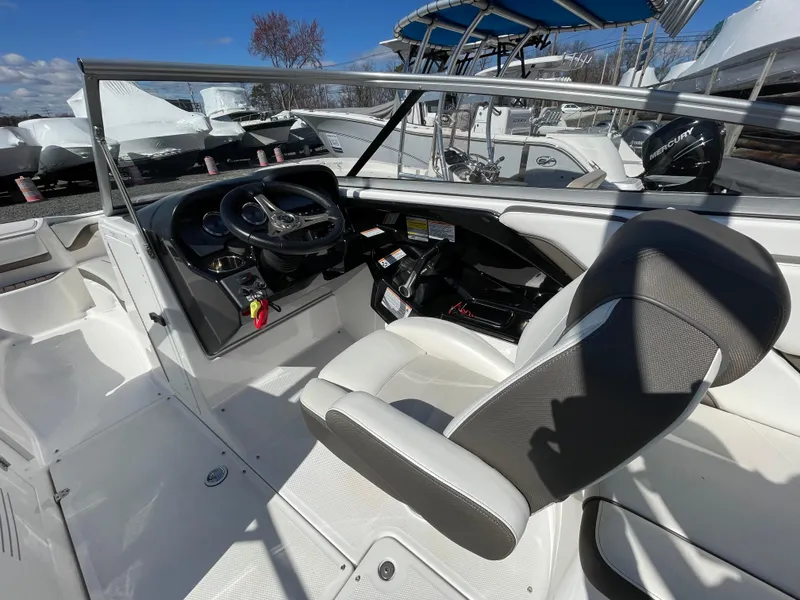 Slide: The Image of Interior of a 2015 Yamaha Boats 242 Limited S with steering console. - 7