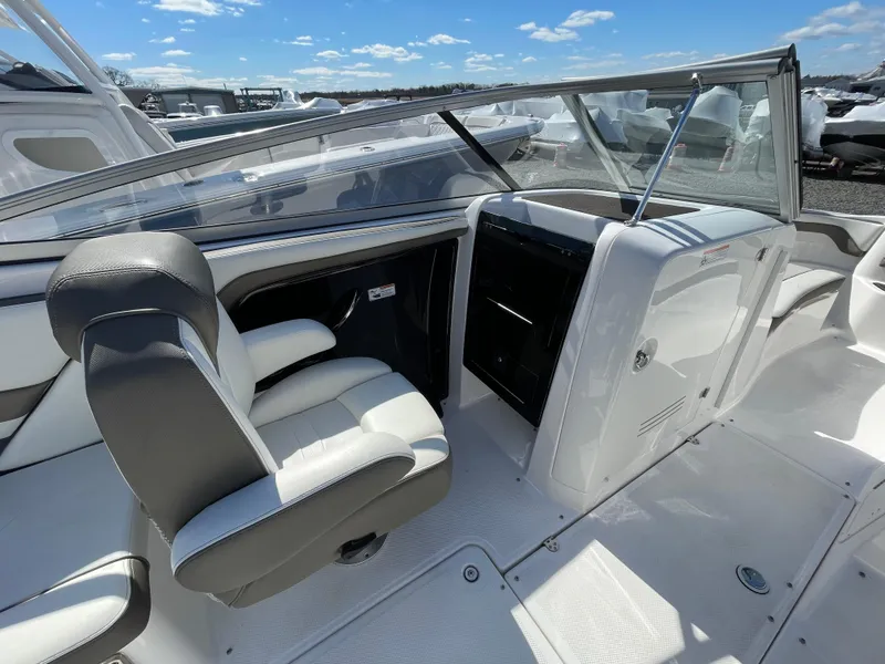 Slide: The Image of Interior of a 2015 Yamaha Boats 242 Limited S with seat and helm console. - 8