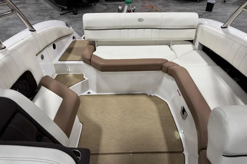 Slide: The Image of Interior of a 2014 Cobalt 276 boat with white and brown seating. - 10