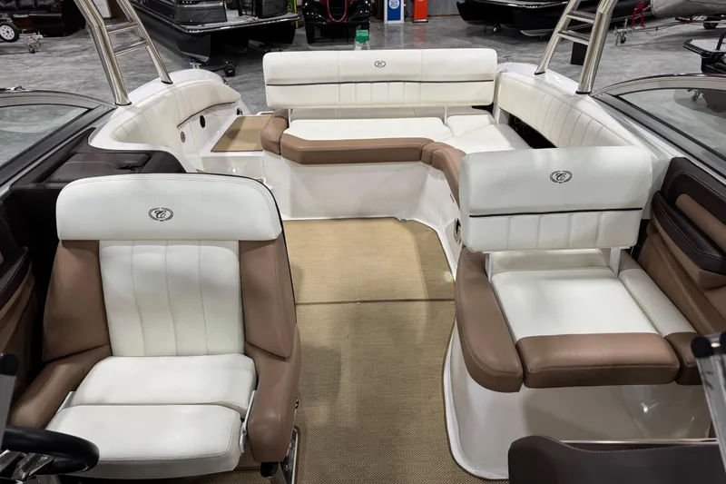 Slide: The Image of Interior of a 2014 Cobalt 276 boat with white and brown seating. - 11