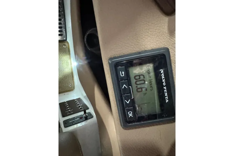 Slide: The Image of Volvo Penta engine hour meter displaying 606.6 hours in a 2014 Cobalt 276 boat. - 16