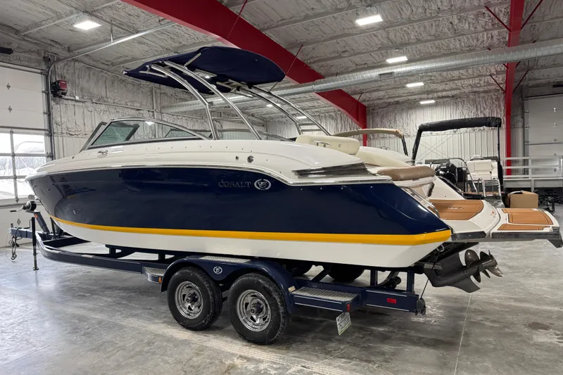 Slide: The Image of 2014 Cobalt 276 boat on trailer in indoor storage facility. - 3