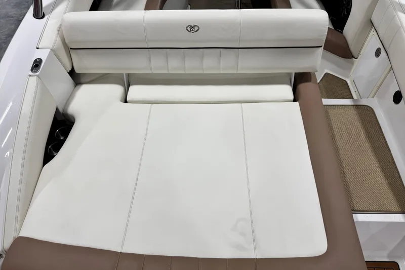 Slide: The Image of 2014 Cobalt 276 boat interior with white and brown seating. - 6